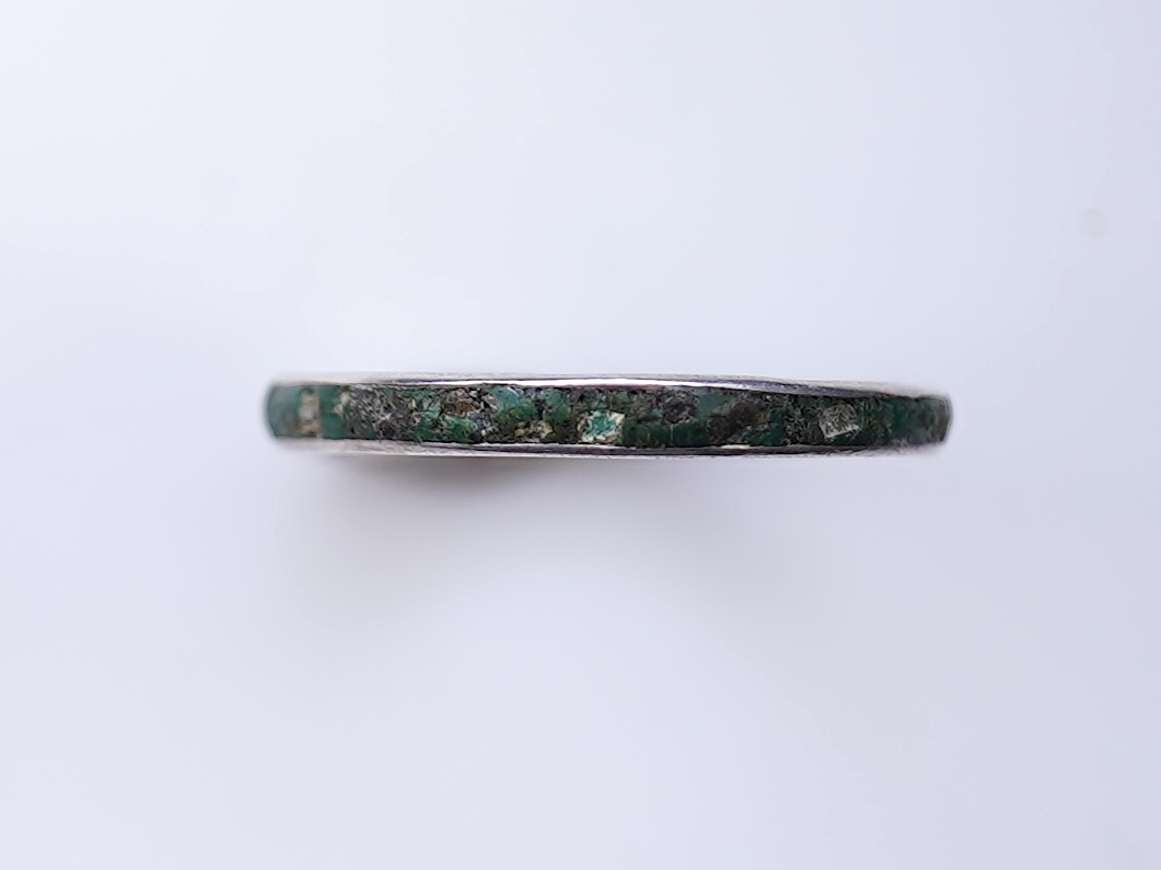 A collection of silver jewels, comprising: a bangle; a chain necklace suspending two winding toothpicks, one with toothpick deficient; a rope twist chain; a pair of cufflinks with the initials DBH; a pendant of abstract